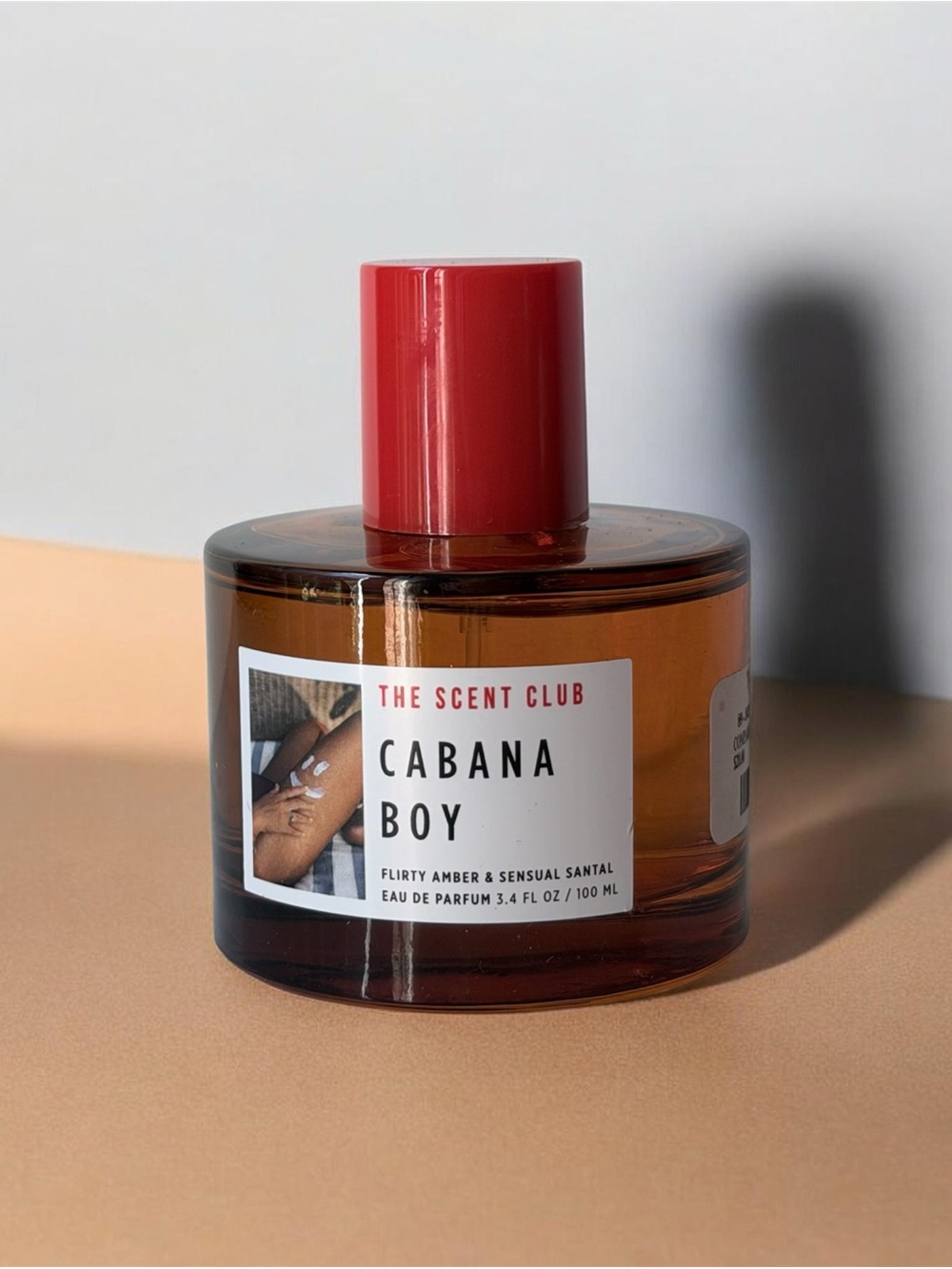 The Scent Club Cabana Boy Eau de Parfum, with notes of amber and sandalwood.